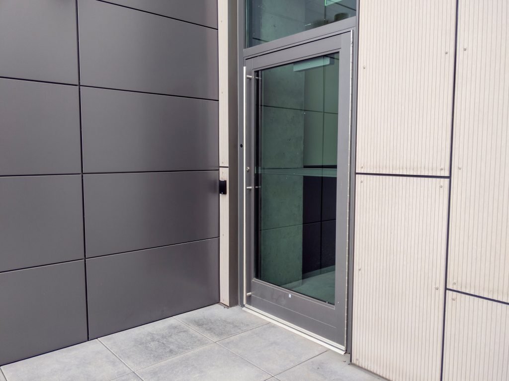 a side entrance door for a business building with a keyless entry box on the side